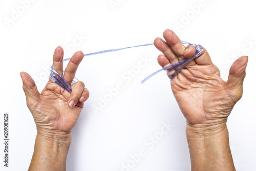 Senior woman's hands pulling blue plastic rope on white background