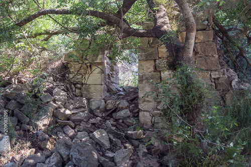 Ruins  of abandoned Palestinian village Kafr Birim in the north of Israel in which the christians Maronites lived until the middle of the 20th century photo