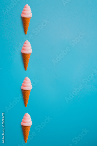plastic ice cream in cones pattern on blue background