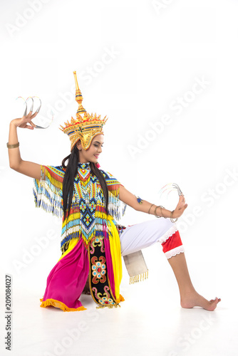 Asian woman in traditional costume of Southern Thailand. Nora dance show. Each finger nail color bead For a beautiful dance.