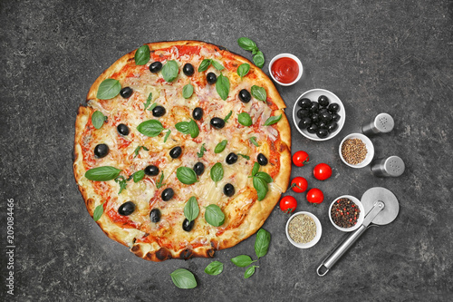 Composition with delicious pizza on dark background