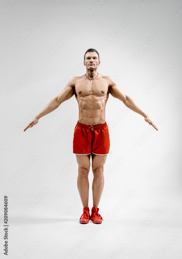 bodybuilder on gray background