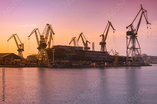 shipyard with large ship under construction