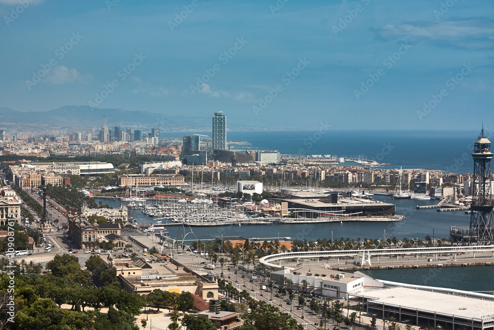 Yachts and sailboats moored in the Port Vell of Barcelona