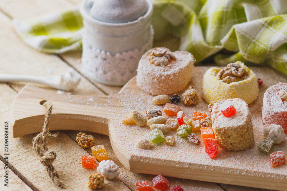 Eastern sweets with fruits, nuts and sugar powder Eastern sweets with fruits, nuts and sugar powder