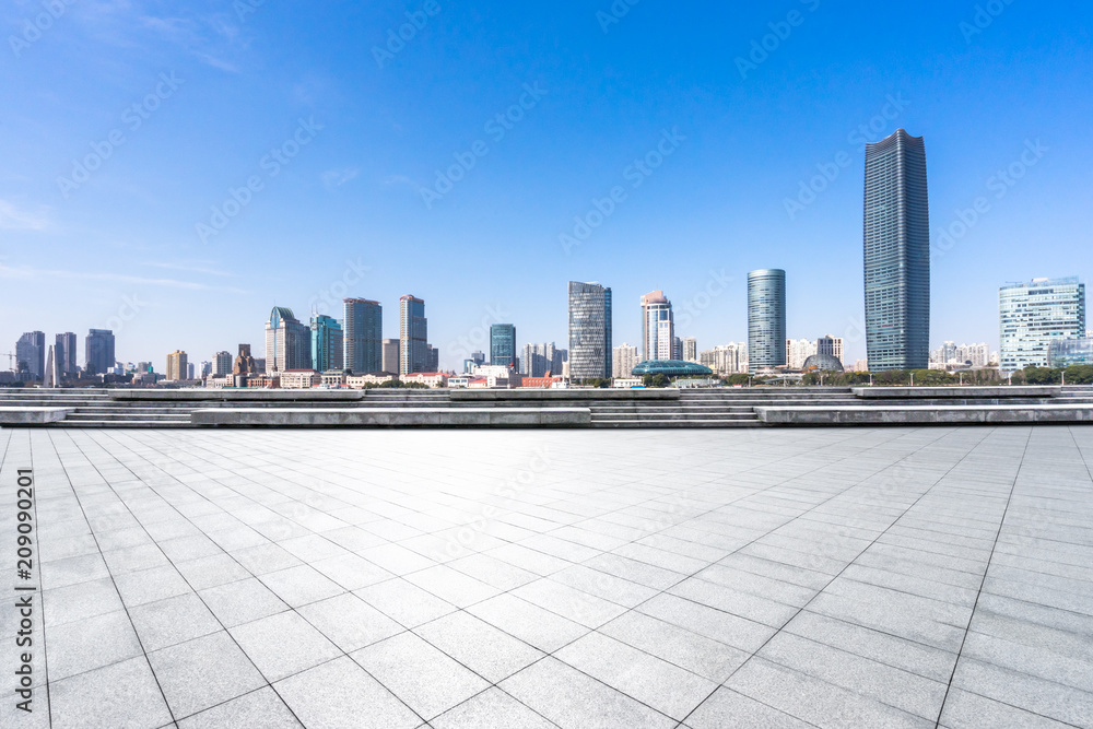 empty  square with panoramic city skyline