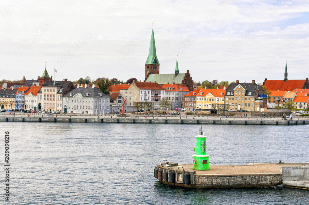 A beautiful view from the harbor of the Scandinavian town of Helsingor - Elsinore, with its colorful roofs. Denmark. Europe. Shakespeare Places. A beautiful view from the harbor of the Scandinavian town of Helsingor - Elsinore, with its colorful roofs. Denmark. Europe. Shakespeare Places.