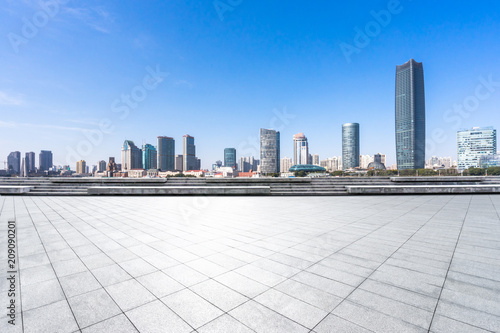 empty square with panoramic city skyline