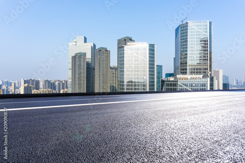 empty asphalt road with modern office building