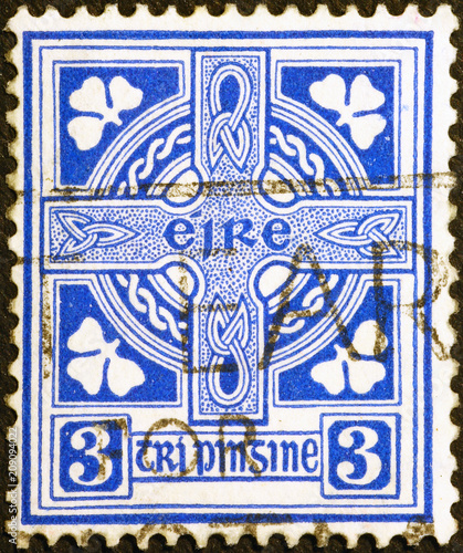 Celtic cross on vintage irish postage stamp