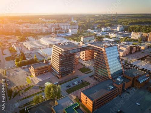 Aerial view of academpark technopark of the Novosibirsk Academic Township -  a large building with laboratories and innovative projects, inventions of a technical charactere at sunset on a sunny day photo