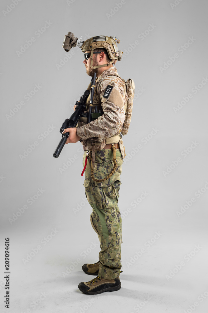 Special forces soldier with rifle on white background. Special forces soldier with rifle on white background.