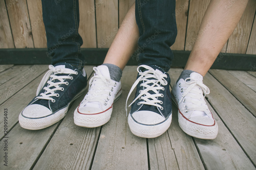 man and woman in stylish sneakers,The concept of a style couple