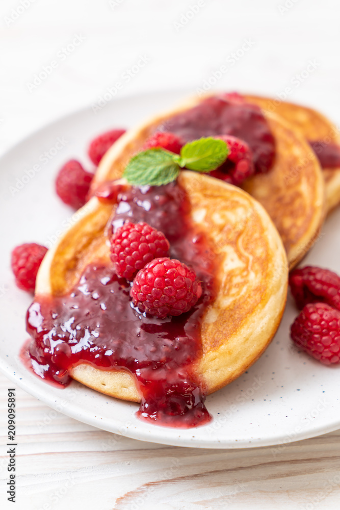 pancake with fresh raspberries and raspberry sauce pancake with fresh raspberries and raspberry sauce