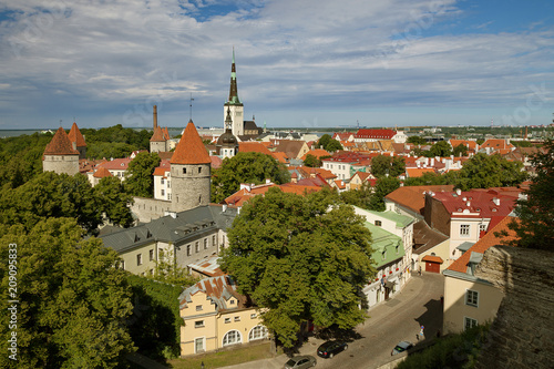 TALLINN, ESTONIA - View from Viewing Point Kohtuotsa, Toompea hill at The Old Town, St. Olaf's Church, Baltic sea and cruise ferry