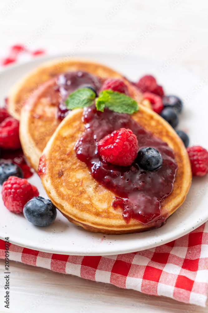 pancake with fresh raspberries and blueberries pancake with fresh raspberries and blueberries