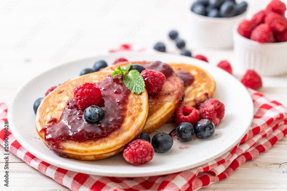 pancake with fresh raspberries and blueberries pancake with fresh raspberries and blueberries