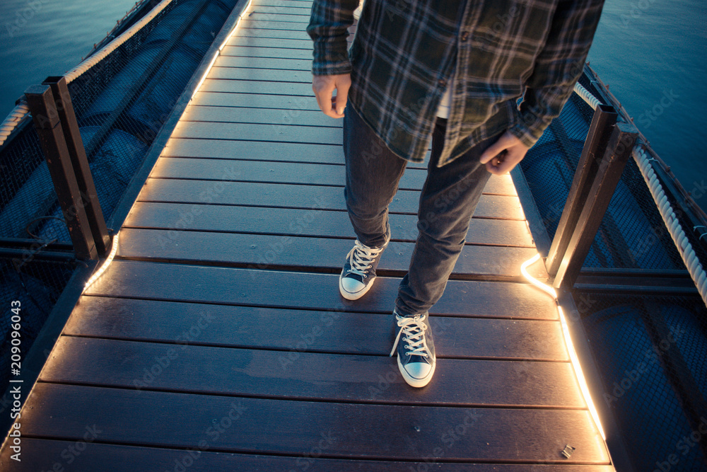 A man Take a walk on a wooden bridge along A man Take a walk on a wooden bridge along