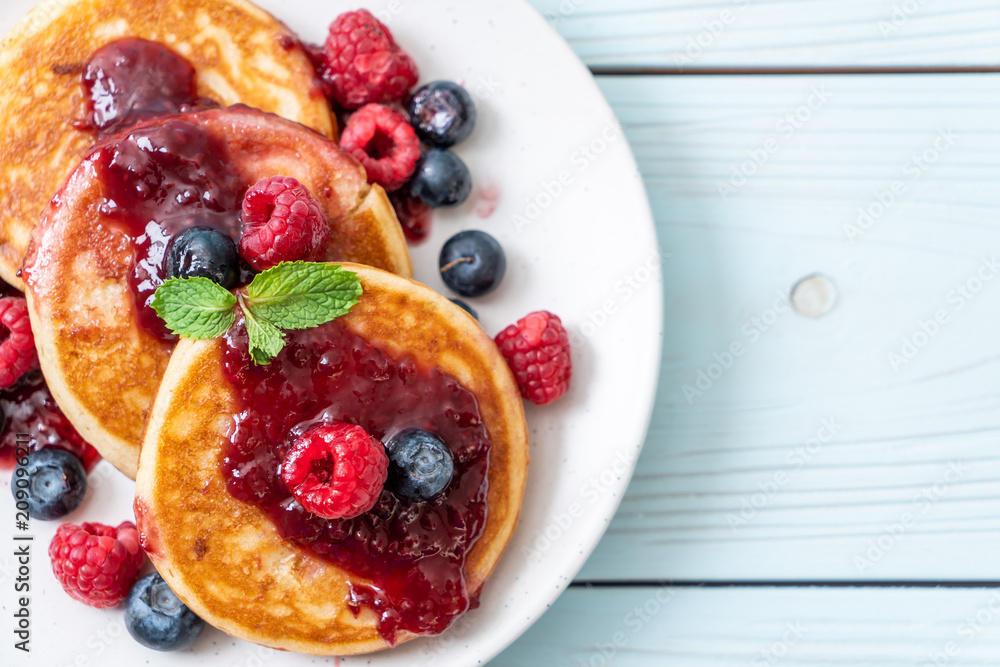 pancake with fresh raspberries and blueberries pancake with fresh raspberries and blueberries