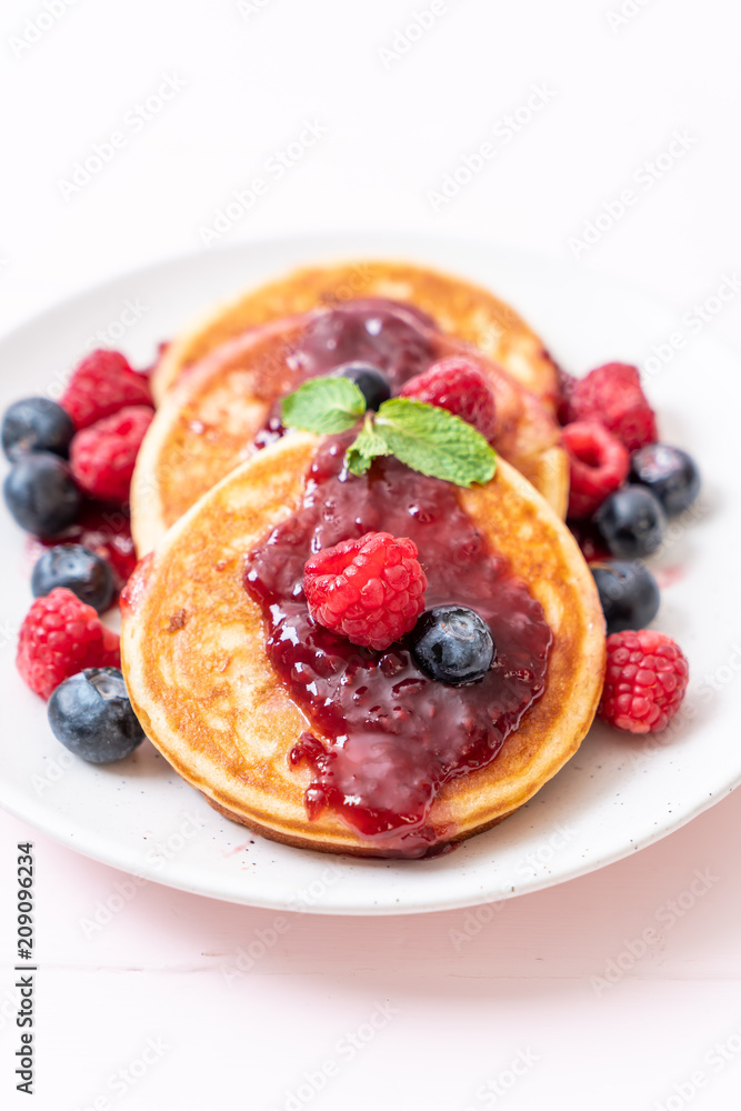 pancake with fresh raspberries and blueberries pancake with fresh raspberries and blueberries