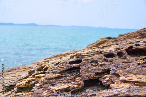 The rock is corroded to the shape of the beach. © Suriya