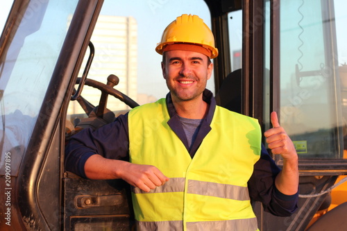 Professional construction industry driver giving thumbs up 