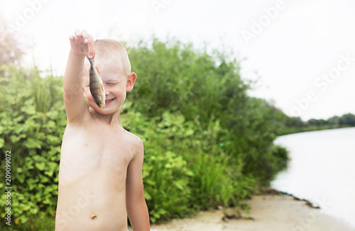little boy caught a fish