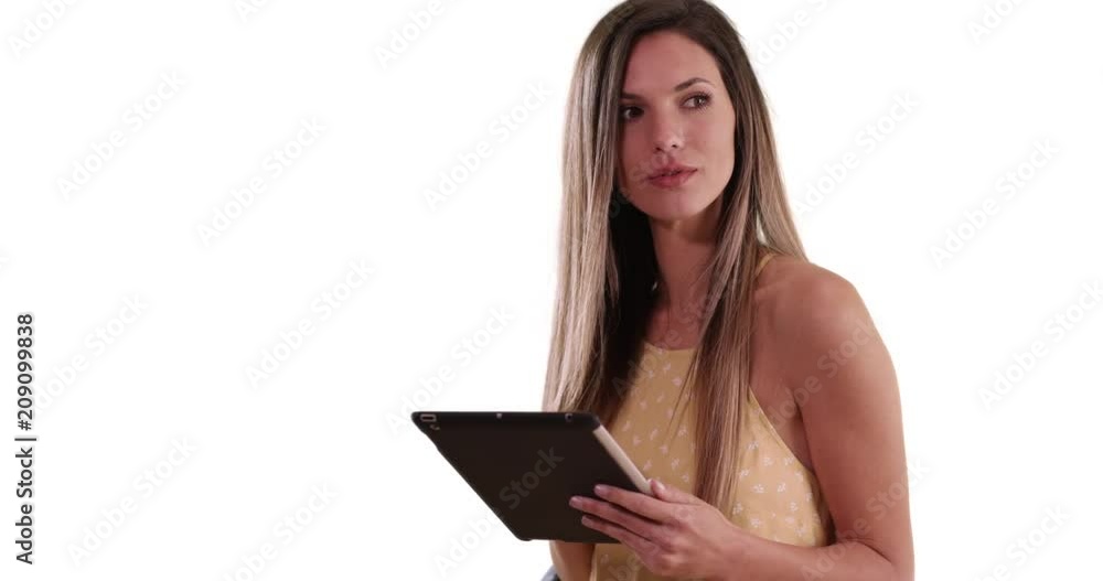 Happy white woman using tablet computer and smiling on solid white background, Friendly Caucasian girl in her 20s using pad device on white copy space alone, 4k Happy white woman using tablet computer and smiling on solid white background, Friendly Caucasian girl in her 20s using pad device on white copy space alone, 4k