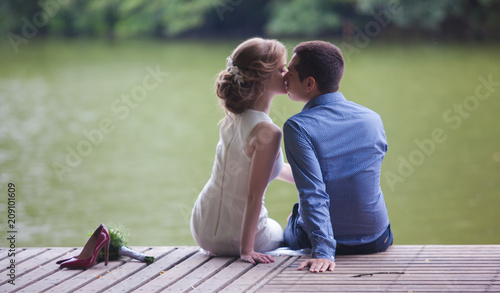 young man and woman on a walk in a park, happiness