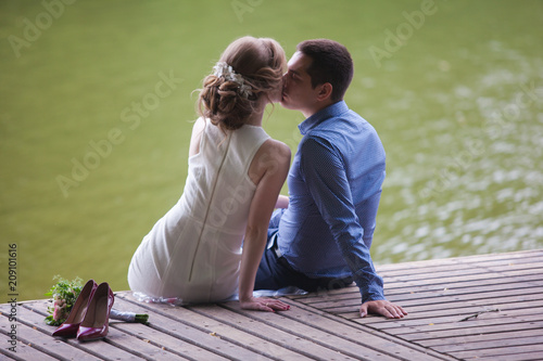 young man and woman on a walk in a park, happiness