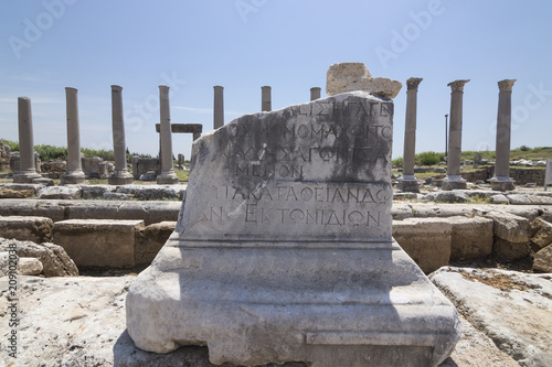 Ancient Roman & Greek writings in a ruin colomn in Perge, Antalya Turkey photo