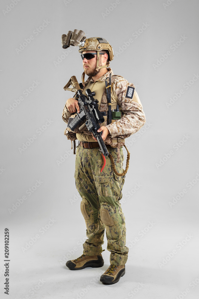 Special forces soldier with rifle on white background. Special forces soldier with rifle on white background.