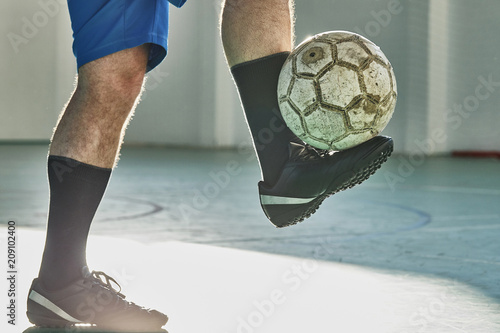 Indoor soccer player balancing the ball photo