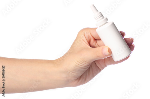Nasal spray for nose in hand on white background isolation