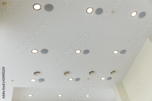 Suspended ceiling and plasterboard with built-in lights in the decoration of the apartment or house