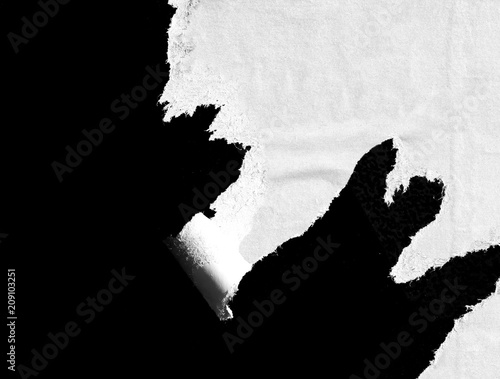 Black white old grunge ripped torn vintage collage posters creased crumpled paper surface texture background / Space for text © Nikola