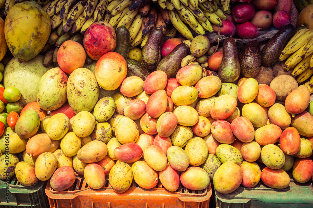 sales stand for a wide variety of mangoes and bananas