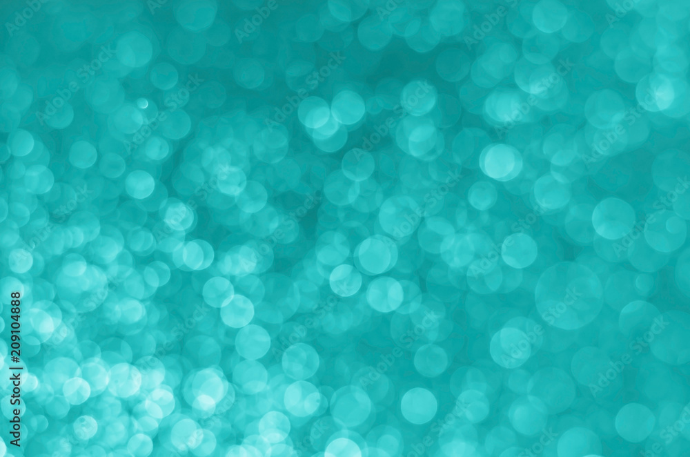 abstract blue bokeh glitter sparkle background.