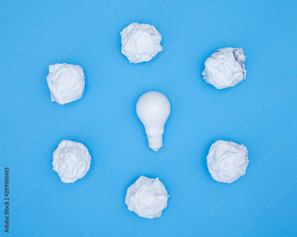 Creativity inspiration, Ideas concepts with light bulb and paper crumpled ball on pastel color background, Flat lay design Creativity inspiration, Ideas concepts with light bulb and paper crumpled ball on pastel color background, Flat lay design