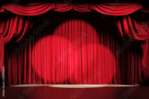 Theater stage with red velvet curtains with spotlights photo