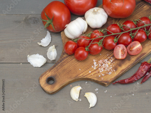 tomatoes on a wooden table. 