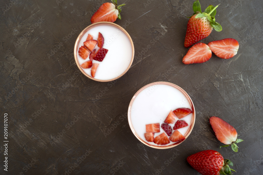 Homemade natural yogurt with strawberries and muesli.