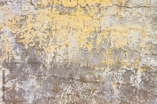 Weathered concrete wall with paint peeled