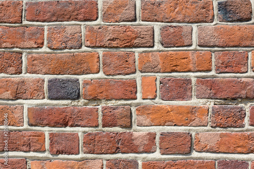 Red brick wall close up. Old ancient architecture background. Building wall structure details.