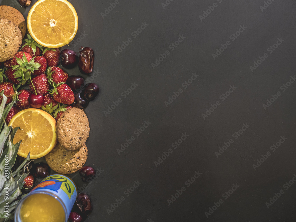 overhead flat lay of sweet low diet launch food concept on black surface copy space