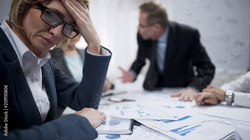 Fotografija Female trying to abstract from screaming boss, occupational burnout, overworked