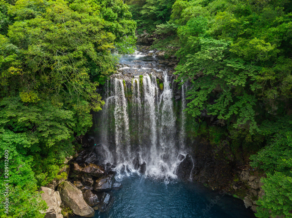 Aerial View of Cheonjeyeon Waterfall on Jeju Island, South Korea Aerial View of Cheonjeyeon Waterfall on Jeju Island, South Korea
