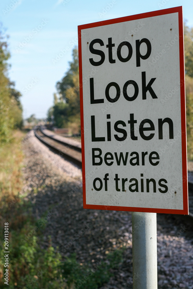 Stop Look Listen Beware of trains sign