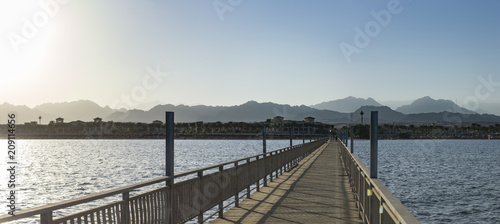 Panorama of the embankment of Sharm El Sheikh. Pier on the Red Sea near one of the coral reefs