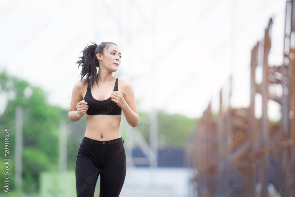 Fitness woman running jogging. Fitness and healthy lifestyle concept.